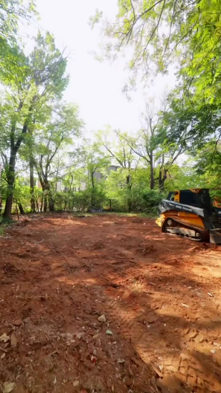 Cleared and graded lot with a skid steer